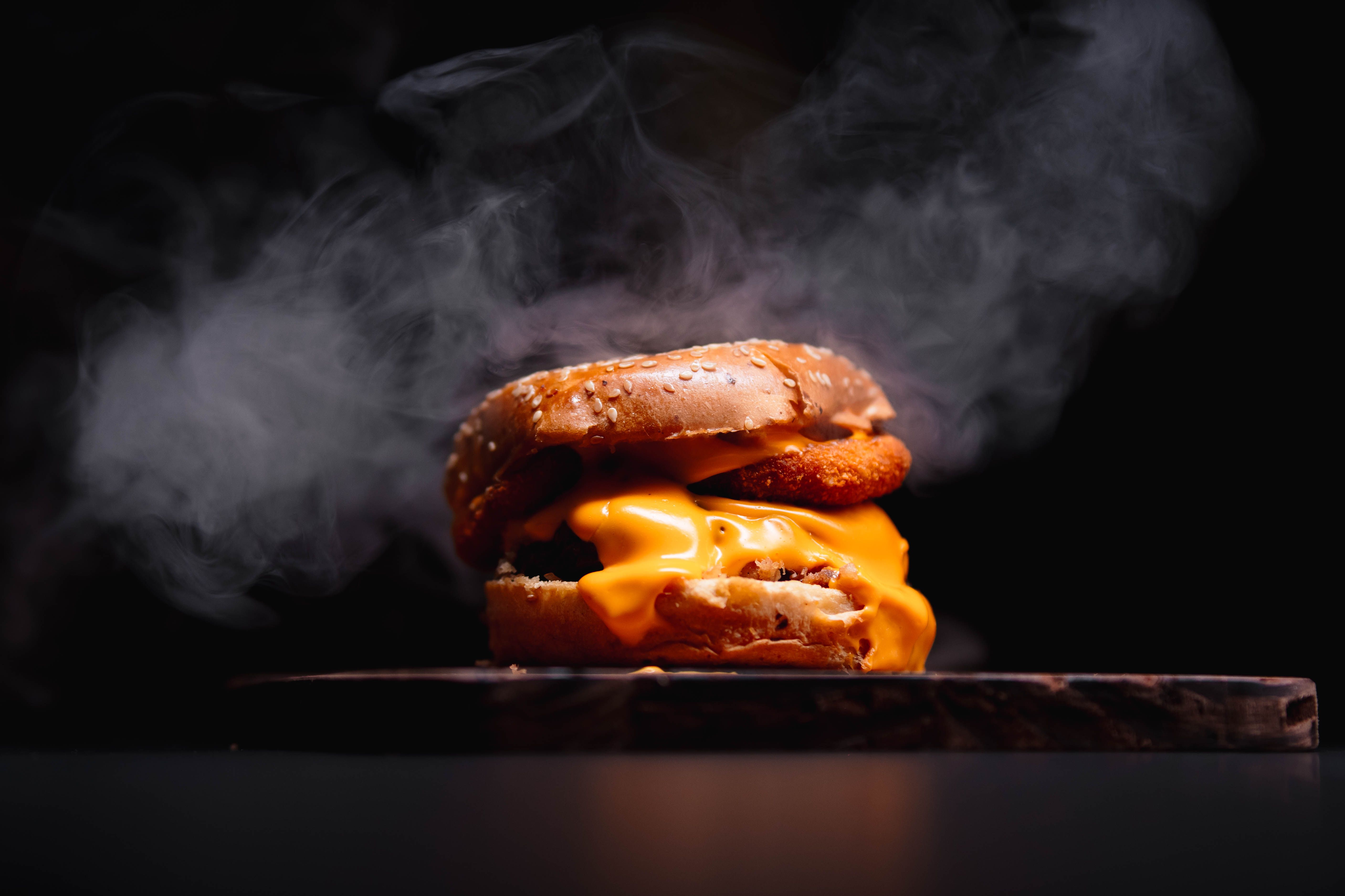 A cheeseburger with lettuce and tomato