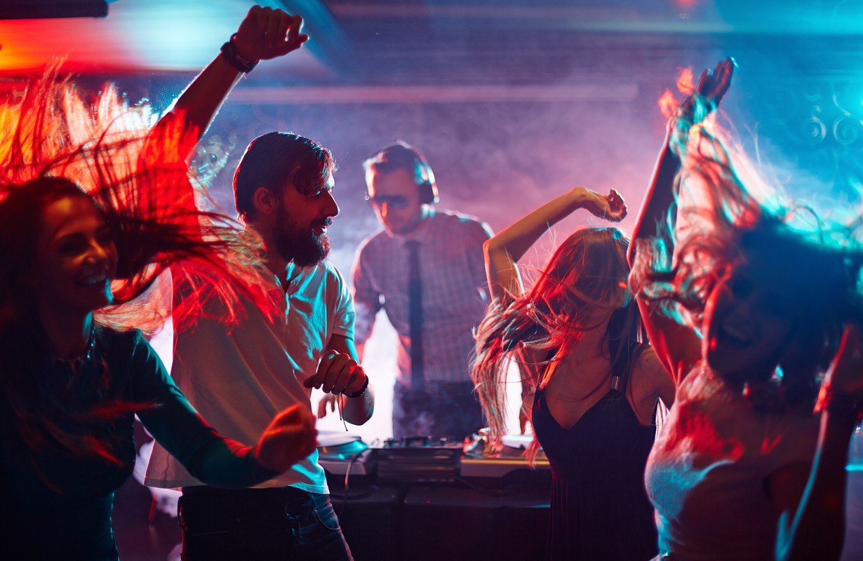 People dancing under party lights